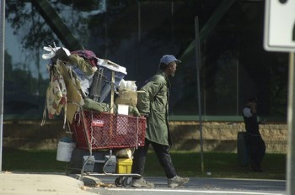 Homeless man with shopping cart of possessions, Charlotte.