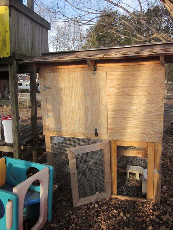 Coop design: allows for both egg gathering and easy harvest of "waste" for the compost bin.