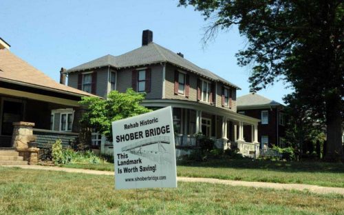 A sign in support of preserving Shober Bridge on the front lawn on Fulton St. in the Historic District.
