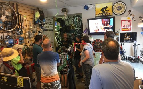 City Walk participants hear from Bart Stetler at Queen City Bicycles on Park Avenue, one of South End's small, locally owned shops. Photo: Mary Newsom