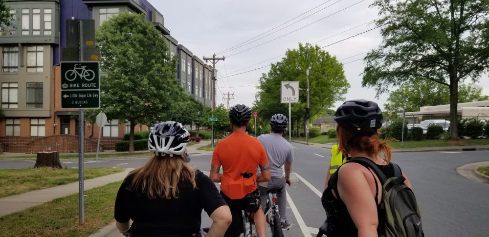 Bicyclists try out Charlotte's first protected bike lane in uptown. Photo: Katie Zager. 