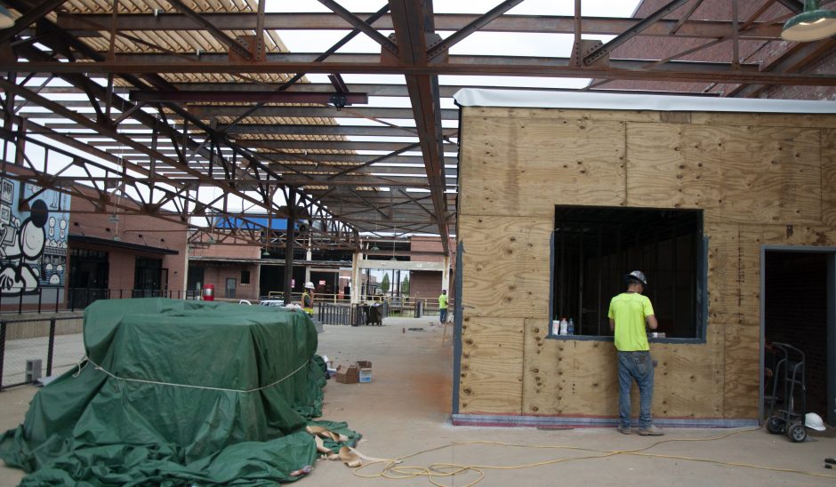 Retail space, including walk-up counters for restaurants, under construction adjacent to the Gama Goat building at Camp North End. Photo: Ely Portillo. 