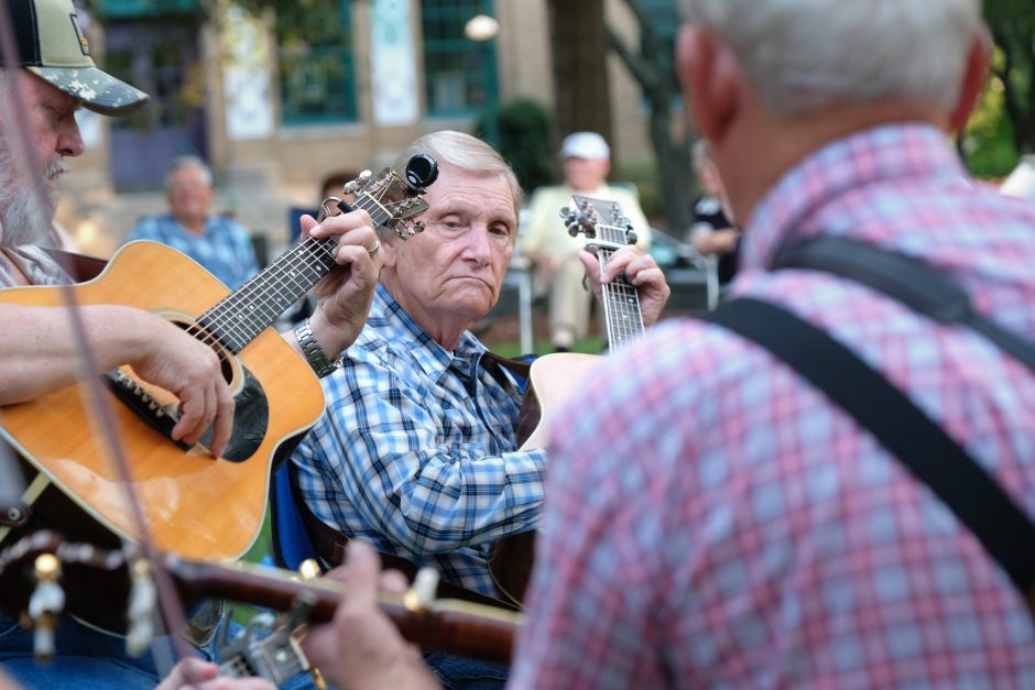 Musicians at the Bluegrass & Old-Time Jam Session on the square in Shelby, playing in front of the Earl Scruggs Center. Photo: Nancy Pierce.