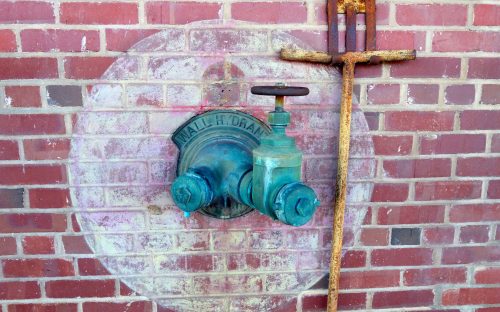 Old hose connection at CAMP North End. Adaptive reuse projects offer a sense of the past as well as a generally "greener" energy footprint than demolition and rebuilding.