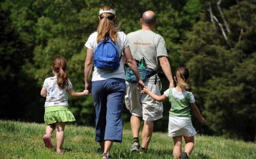 A family walks at the Anne Springs Close Greenway in April 2010.
