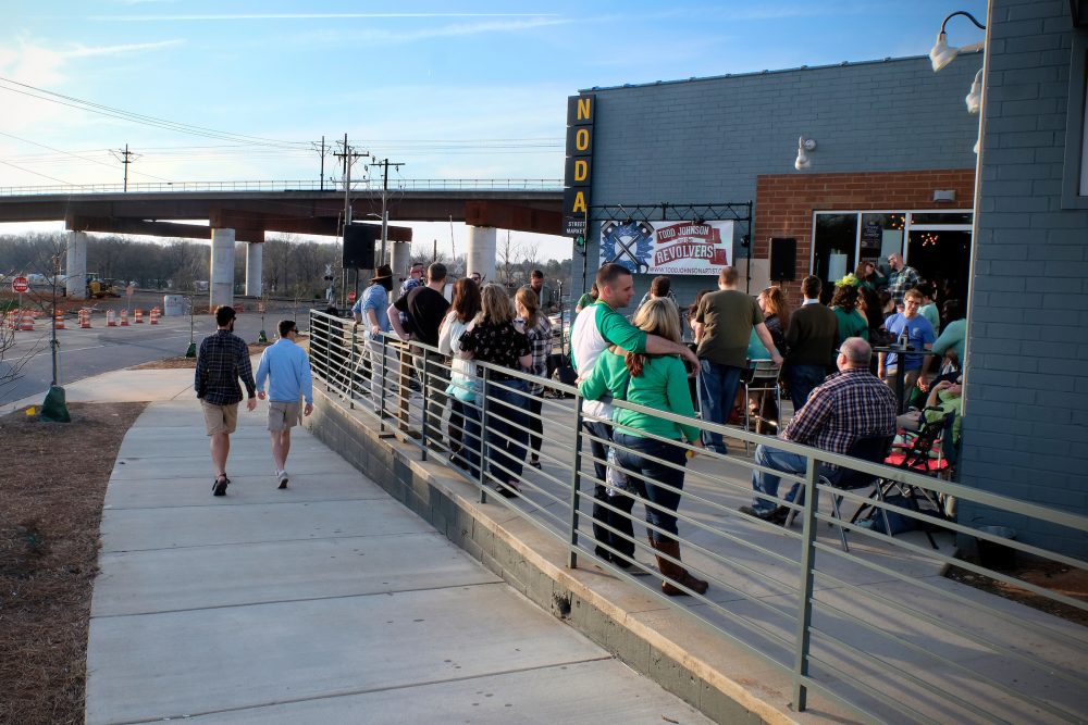 On the newly opened Blue Line Extension at North Davidson Street and Craighead Road, NoDa Street Market opened in summer 2017, offering a coffee house, pub, restaurants and a brewery. Situated between the 36th Street and Sugar Creek Road stations, this area shows how NoDa's entertainment district is expanding northward into old industrial buildings. Photo: Nancy Pierce