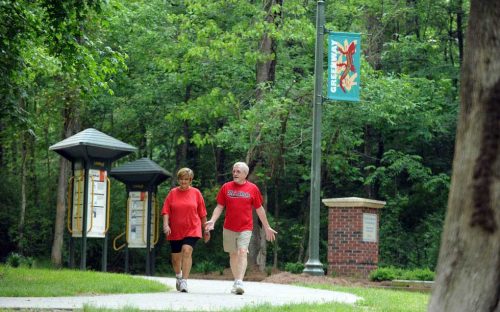 A couple strolls along the McEachern Greenway in Concord in May 2010.