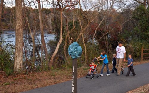 A family walks along the Piedmont Medical Center Trail in November 2011.