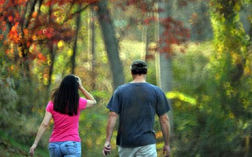 A couple walks along the Piedmont Medical Center Trail in November 2011.