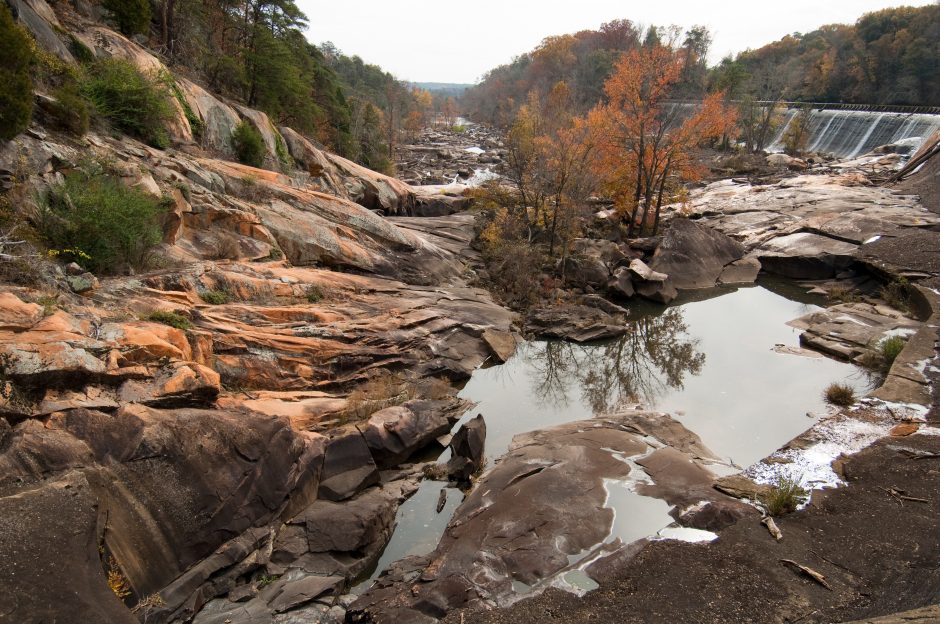 The dry channel at Great Falls, S.C. The falls once crashed over these rocks, before they were diverted for hydroelectric power. This is where Duke Energy plans to release more water into the channel to fuel whitewater adventures. Photo: Nancy Pierce