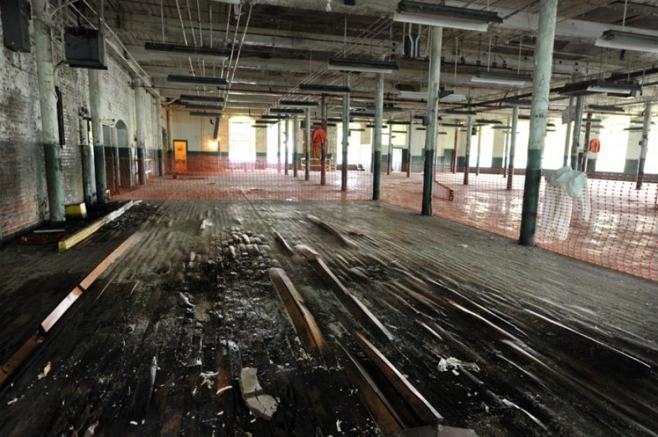 Water damage to floor beams will be repaired before this floor is sandblasted. Photo: Nancy Pierce