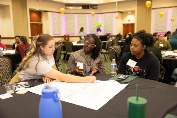 Participants at a previous W+GRA Leadership Cafe.