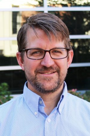 A headshot of Associate Professor of Sociology Vaughn Schmutz, Ph.D.