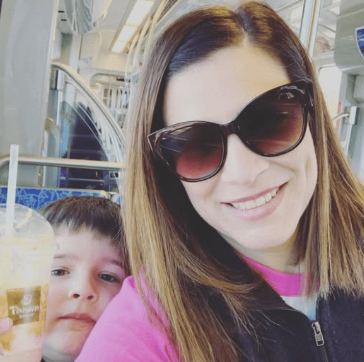 Liz and her son on the Light Rail.