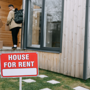 Two people moving into a home for rent. Stock image.