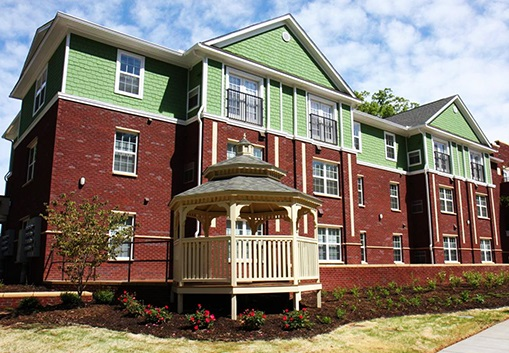 Green and brown multifamily City of Charlotte Housing Trust Fund residence.
