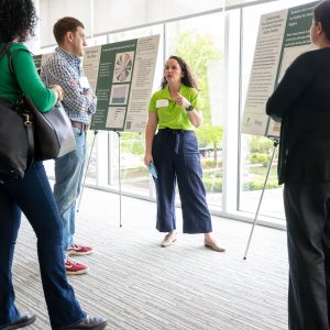 A group of people discuss data at a Charlotte Urban Institute event.