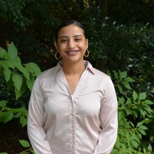 A photo of Fatima Rodriguez Caba in the UNC Charlotte botanical garden.