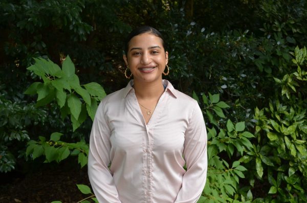 A photo of Fatima Rodriguez Caba in the UNC Charlotte botanical garden.